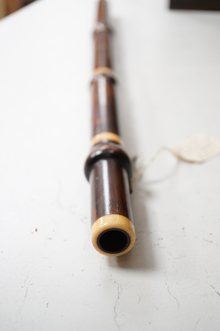 A 19th century crocus wood and ivory flute possibly by Metzler, six holes and one key to the foot joint, 60.5cm long, ivory submission ref: HMMH3U4M